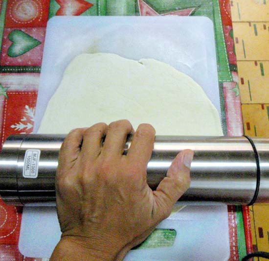 use a rolling pin or a thermos or wine bottle to flatten it even more, retaining the round shape