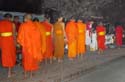 monks in their early morning alms ritual
