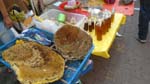 honey seller with honeycomb as convincing prop
