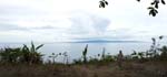 on top of the island, overlooking the  water and seeing the island of Siquijor on the horizon