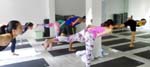conducting a Power Yoga class at Yoga Inc, Singapore