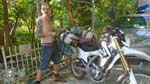 a Russian meditator loading up his bike for the post-meditation cross country tour across China