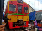 Parting of the Maeklong Railway Market with a Passing Train
